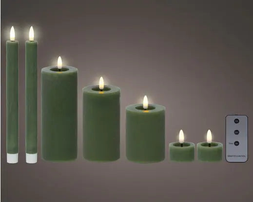 Set of green LED candles with remote control on a gray background
