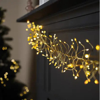 String of lights draped over a dark surface with a blurred background