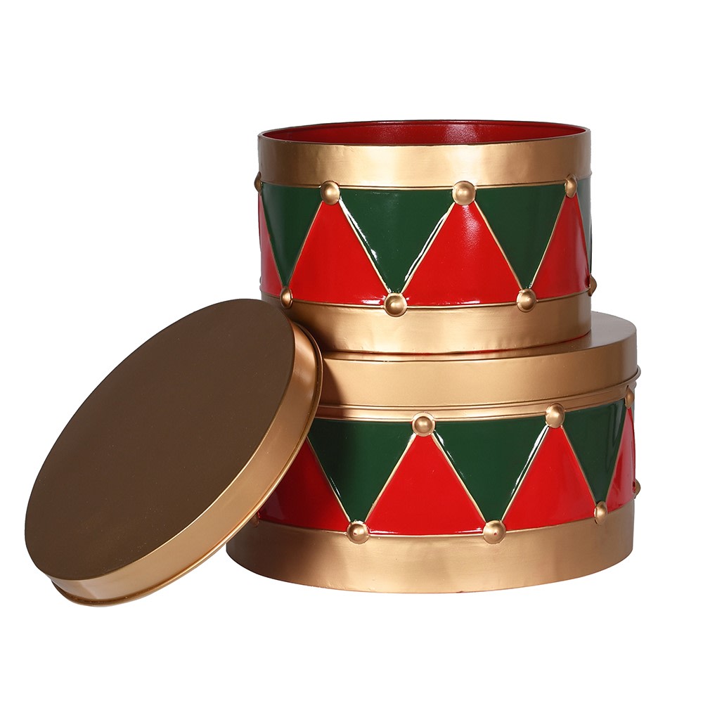 A set of two metal drummer tins with a geometric pattern in red, green, and gold colors, one large and one small, placed next to each other.