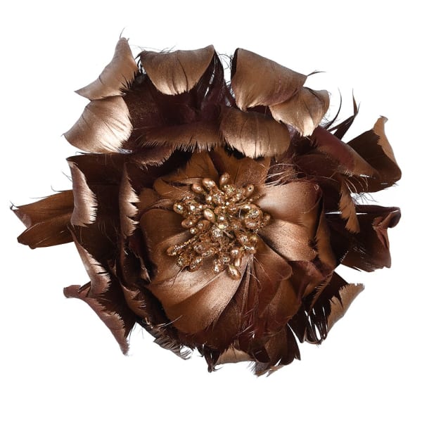 Brown feathered flower accessory with a central brooch on a white background