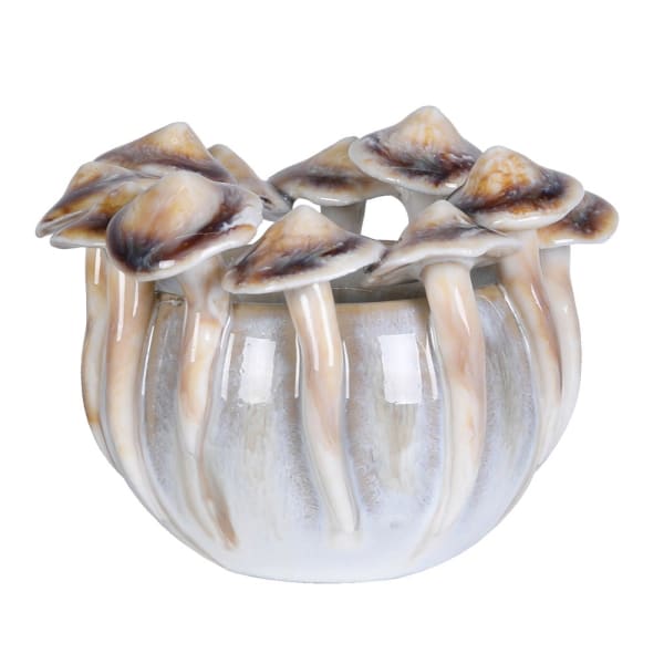 Decorative item resembling a cluster of mushrooms with a glass base on a white background
