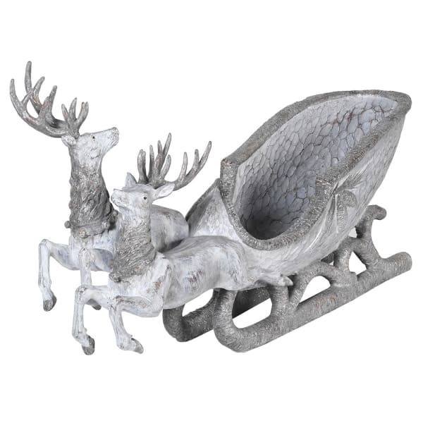 Decorative sculpture of two deer pulling a sleigh with a cracked eggshell design on a white background.