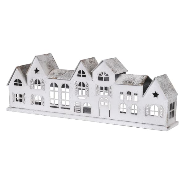 Decorative white house-shaped candle holder on a white background