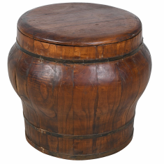 A rustic wooden barrel-style stool with a round top and visible wood grain, isolated on a white background.