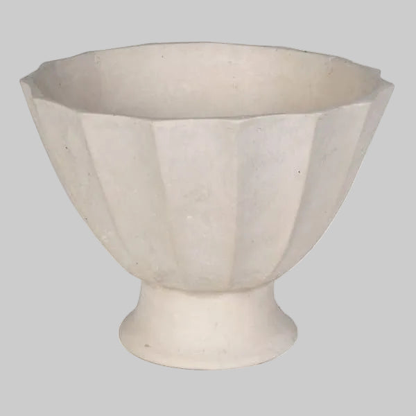 A light beige ceramic planter with a fluted, pedestal base and wide, scalloped rim, shown against a plain white background.